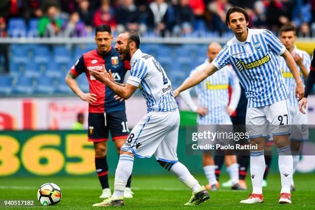 Pasquale Schiattarella and Dias Da Silva Dal Bello Felipe of Spal disturb Gianluca Lapadula of Genoa as he prepares to shoot a penalty kick during...