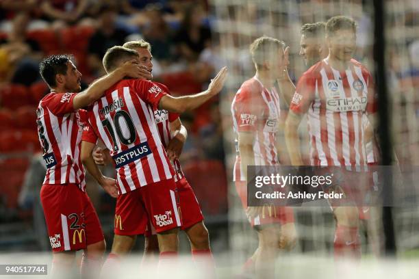 Dario Vidosic of Melbourne City celebrates his goal with team mates during the round 25 A-League match between the Newcastle Jets and Melbourne City...