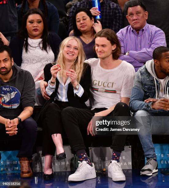 Dakota Fanning and Henry Frye attend New York Knicks vs Detroit Pistons game at Madison Square Garden on March 31, 2018 in New York City.