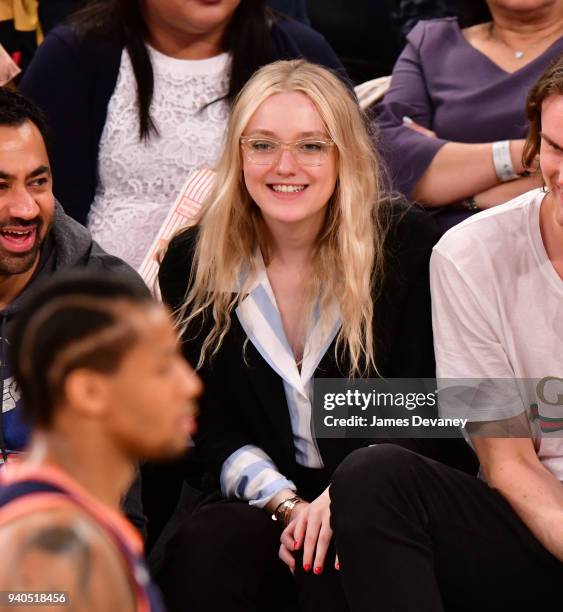 Dakota Fanning attends New York Knicks vs Detroit Pistons game at Madison Square Garden on March 31, 2018 in New York City.