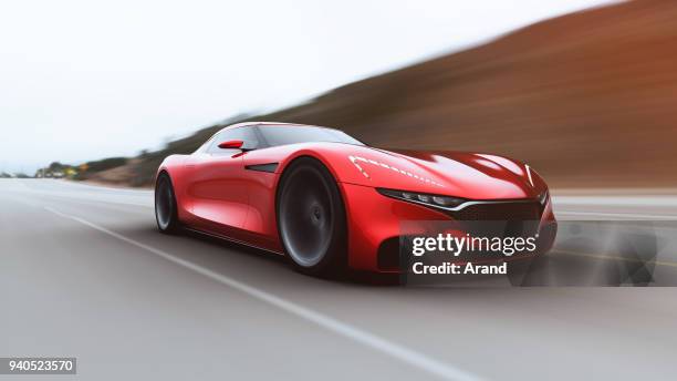 red car driving on a road - luxury sports car stock pictures, royalty-free photos & images