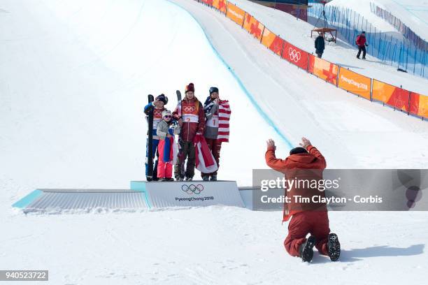 Marie Martinod of France after winning the silver medal with daughter Meli Rose along with gold medalist Cassie Sharpe of Canada and bronze medalist...