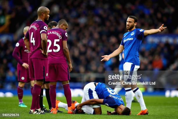 Dominic Calvert-Lewin and Cenk Tosun both of Everton react after a challenge during the Premier League match between Everton and Manchester City at...