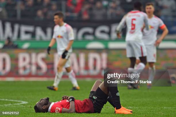 Salif Sane of Hannover looks dejected after the Bundesliga match between Hannover 96 and RB Leipzig at HDI-Arena on March 31, 2018 in Hanover,...