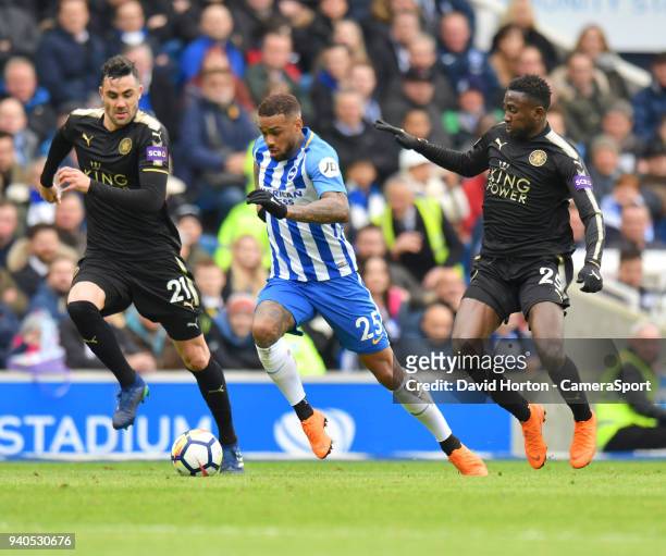 Leicester City's Vicente Iborra & ilfred Ndidi battles with Brighton & Hove Albion's Jurgen Locadia during the Premier League match between Brighton...