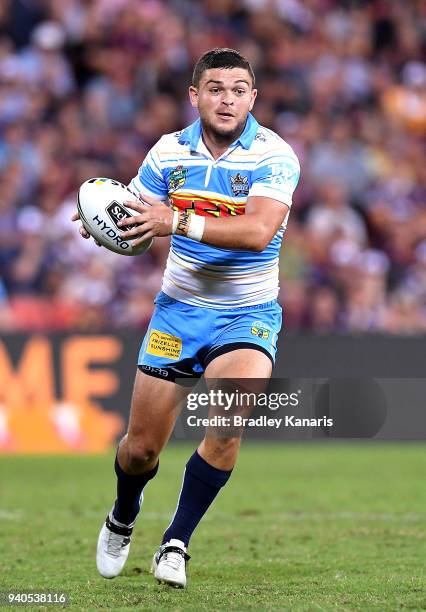 Ash Taylor of the Titans runs with the ball during the round four NRL match between the Brisbane Broncos and the Gold Coast Titans at Suncorp Stadium...