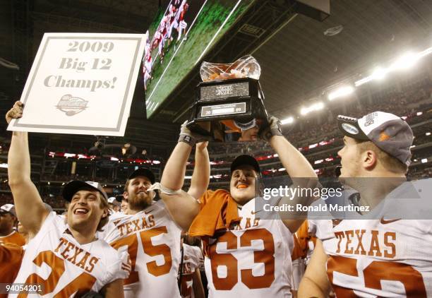 The Texas Longhorns celebrate their 10-6 victory over the Nebraska Cornhuskers in the game at Cowboys Stadium on December 5, 2009 in Arlington, Texas.