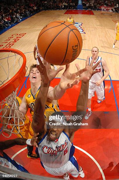 Craig Smith of the Los Angeles Clippers reaches for a rebound against Tyler Hansbrough of the Indiana Pacers at Staples Center on December 5, 2009 in...