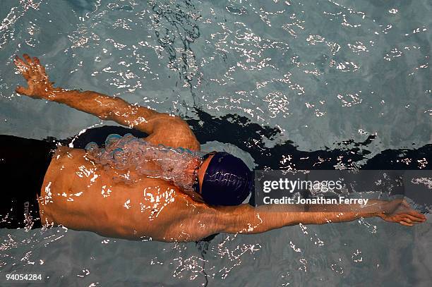 David Russell swims the 200 yard backstroke during day three of the AT&T Short Course Nationals at Weyerhaeuser King County Aquatic Center on...