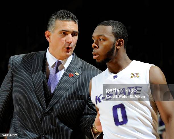 Head coach Frank Martin of the Kansas State Wildcats talks with guard Jacob Pullen during the second half against the Washington State Cougars on...