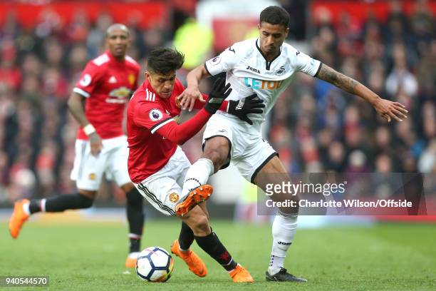 Alexis Sanchez of Man Utd and Kyle Naughton of Swansea battle for the ball during the Premier League match between Manchester United and Swansea City...