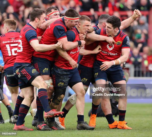 Andrew Conway of Munster celebrates with team mate and the crowd after scoring a crucial late second half try during the European Rugby Champions Cup...