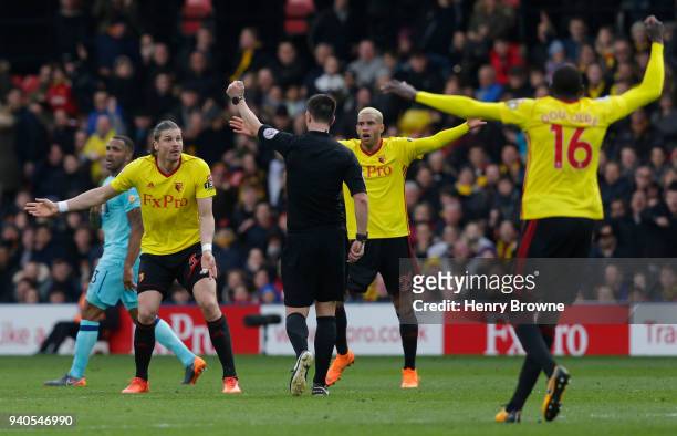 Sebastian Prodl and Etienne Capoue of Watford appeal to the referee during the Premier League match between Watford and AFC Bournemouth at Vicarage...