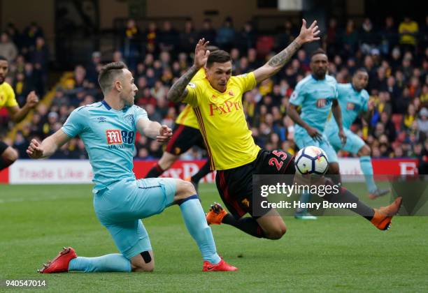 Marc Pugh of AFC Bournemouth and Jose Holebas of Watford during the Premier League match between Watford and AFC Bournemouth at Vicarage Road on...