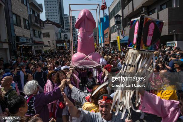 Large pink phallic-shaped 'Mikoshi' is paraded through the streets during Kanamara Matsuri on April 1, 2018 in Kawasaki, Japan. The Kanamara Festival...