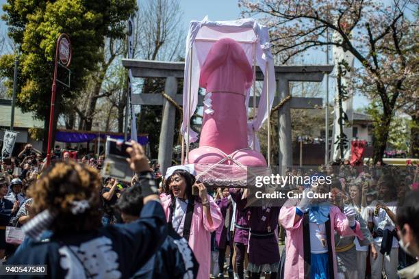 Large pink phallic-shaped 'Mikoshi' is paraded through the streets during Kanamara Matsuri on April 1, 2018 in Kawasaki, Japan. The Kanamara Festival...