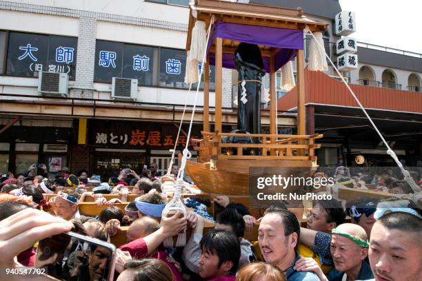 People carry portable shrines bearing phalluses during the annual Kanamara Festival at Kanayama Shrine in Kawasaki on April 1 Kawasaki, Japan. The...