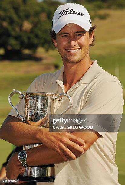 Adam Scott of Australia holds the Stonehaven trophy after winning the Australian Open golf tournament in Sydney on December 6, 2009. Scott broke...