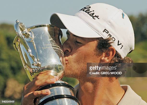 Adam Scott of Australia kisses the Stonehaven trophy after winning the Australian Open golf tournament in Sydney on December 6, 2009. Scott broke...