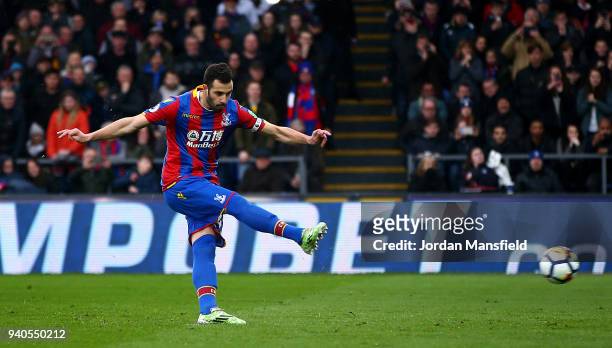 Luka Milivojevic of Crystal Palace scores a penalty for his sides first goal during the Premier League match between Crystal Palace and Liverpool at...
