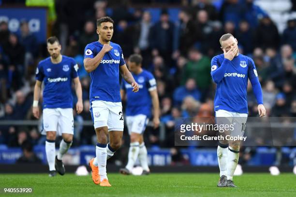 Dominic Calvert-Lewin of Everton and Wayne Rooney of Everton look dejected during the Premier League match between Everton and Manchester City at...