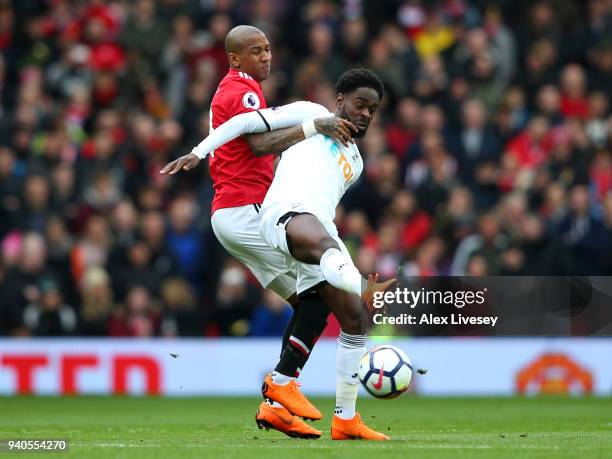 Nathan Dyer of Swansea City is challenged by Ashley Young of Manchester United during the Premier League match between Manchester United and Swansea...