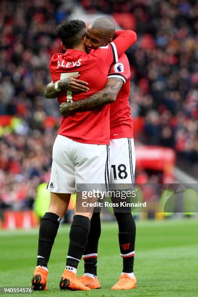 Alexis Sanchez of Manchester United celebrates with Ashley Young of Manchester United after he scores his sides second goal during the Premier League...