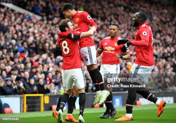 Alexis Sanchez of Manchester United celebrates with teammates after scoring his sides second goal during the Premier League match between Manchester...