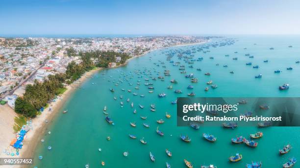 aerial drone view of thousand of boat and ship in mui ne village, phan thiet, vietnam - mui ne beach stockfoto's en -beelden