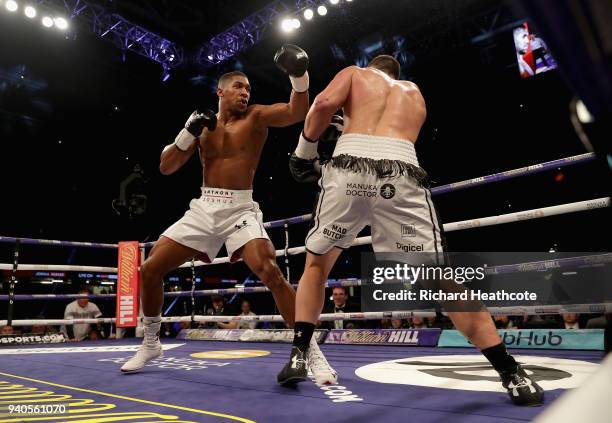 Anthony Joshua punches Joseph Parker during there WBA, IBF, WBO & IBO Heavyweight Championship title fight at Principality Stadium on March 31, 2018...