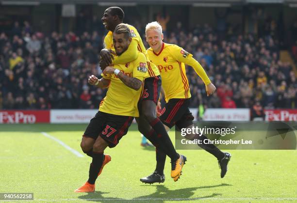 Roberto Pereyra of Watford celebrates with teammates Abdoulaye Doucoure and Will Hughes after scoring his sides second goal during the Premier League...