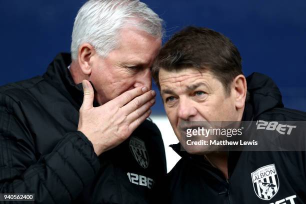 Alan Pardew, Manager of West Bromwich Albion speaks to John Carver during the Premier League match between West Bromwich Albion and Burnley at The...