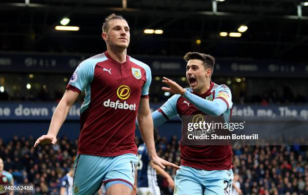 Chris Wood of Burnley celebrates with teammate Matthew Lowton after scoring his sides second goal during the Premier League match between West...