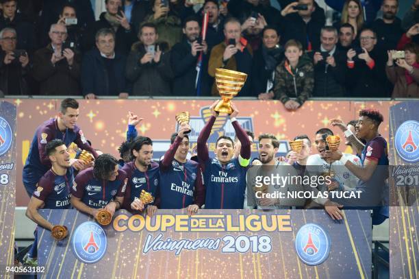 Paris Saint-Germain's players celebrate after victory in the French League Cup final football match between Monaco and Paris Saint-Germain at The...
