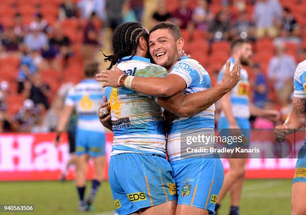 Ash Taylor and Konrad Hurrell of the Titans celebrate victory after the round four NRL match between the Brisbane Broncos and the Gold Coast Titans...