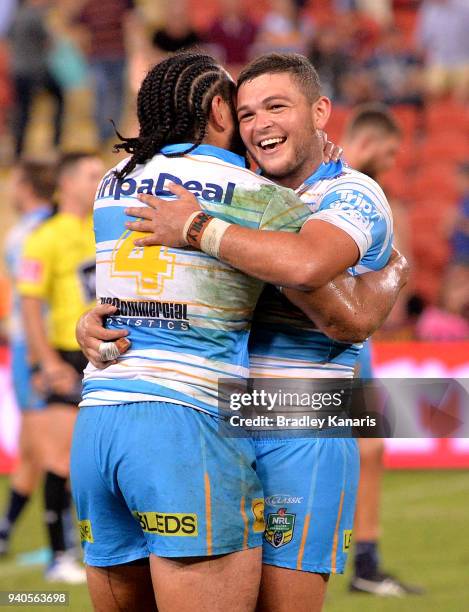 Ash Taylor and Konrad Hurrell of the Titans celebrate victory after the round four NRL match between the Brisbane Broncos and the Gold Coast Titans...