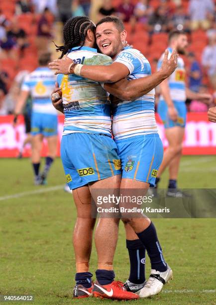 Ash Taylor and Konrad Hurrell of the Titans celebrate victory after the round four NRL match between the Brisbane Broncos and the Gold Coast Titans...