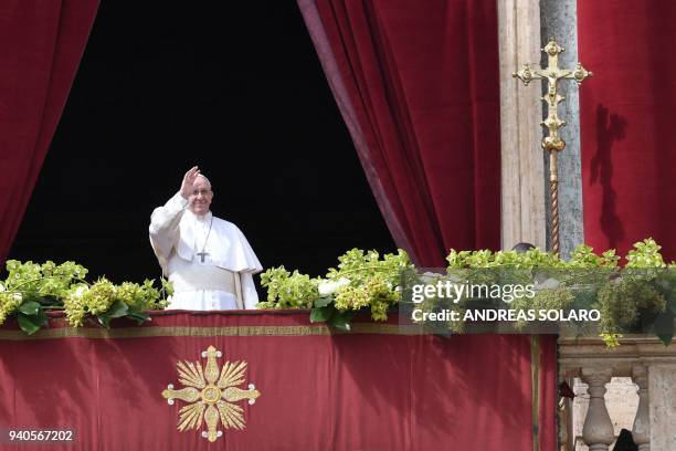 Pope Francis delivers the "Urbi et Orbi" blessing to the city and to the world from the balcony of St Peter's basilica after the Easter Sunday Mass...