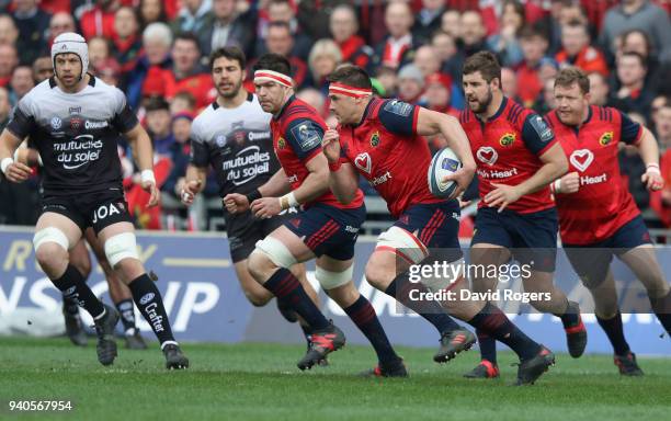 Stander of Munster breaks with the ball during the European Rugby Champions Cup match between Munster Rugby and RC Toulon at Thomond Park on March...