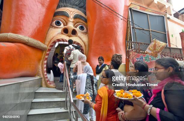 People visit temple to offer prayers on the occasion of Hanuman Jayanti at the Hanuman temple near Link Road, on March 31, 2018 in New Delhi, India....