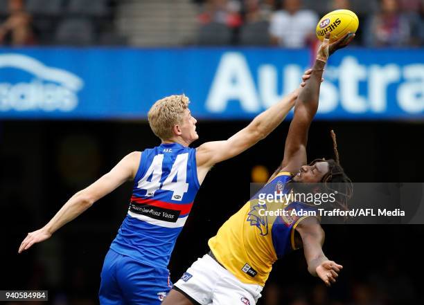 Tim English of the Bulldogs and Nic Naitanui of the Eagles compete in a ruck contest during the 2018 AFL round 02 match between the Western Bulldogs...