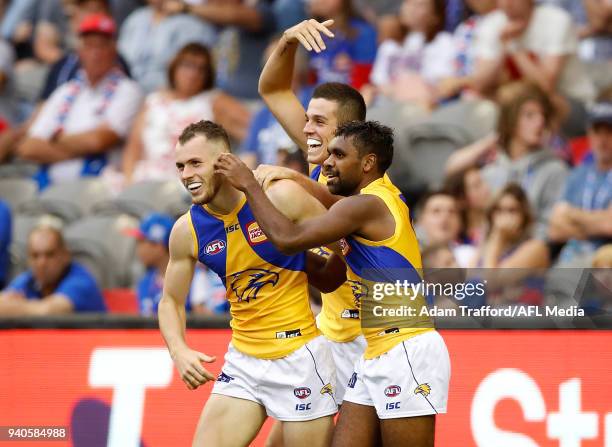 Daniel Venables of the Eagles celebrates his first AFL goal with with teammates Jake Waterman and Liam Ryan of the Eagles during the 2018 AFL round...