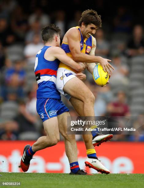 Andrew Gaff of the Eagles is tackled by Toby McLean of the Bulldogs during the 2018 AFL round 02 match between the Western Bulldogs and the West...