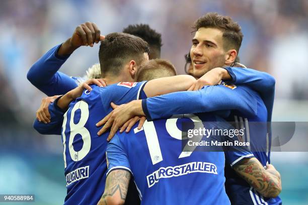 Guido Burgstaller of Schalke celebrates with his team after he scored a goal to make it 2:0 during the Bundesliga match between FC Schalke 04 and...