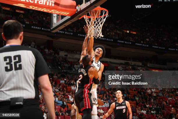 Allen Crabbe of the Brooklyn Nets goes to the basket against Wayne Ellington of the Miami Heat on March 31st, 2018 at American Airlines Arena in...