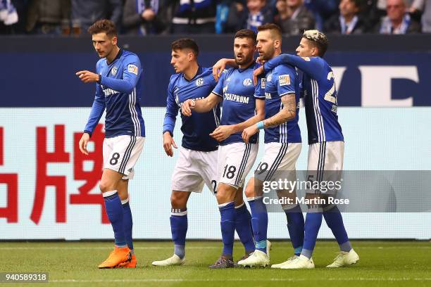 Daniel Caligiuri of Schalke celebrates with his team after he scored a penalty goal to make it 1:0 during the Bundesliga match between FC Schalke 04...