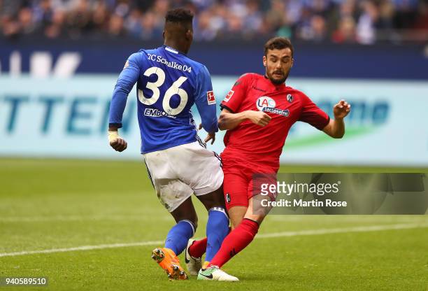 Breel Embolo of Schalke is being found by Manuel Gulde of Freiburg, which leads to a penalty for Schalke, during the Bundesliga match between FC...