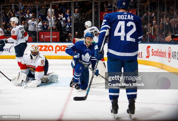 James van Riemsdyk of the Toronto Maple Leafs celebrates his 200th career goal with teammate Tyler Bozak against Roberto Luongo of the Florida...