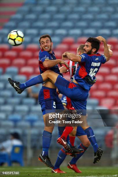 Ben Kantarovski and Nicholas Cowburn of the Jets contest the ball during the round 25 A-League match between the Newcastle Jets and Melbourne City at...