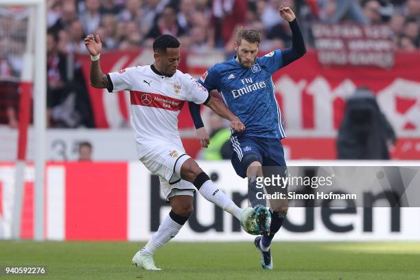 Dennis Aogo of Stuttgart fights for the ball with Aaron Hunt of Hamburg during the Bundesliga match between VfB Stuttgart and Hamburger SV at...